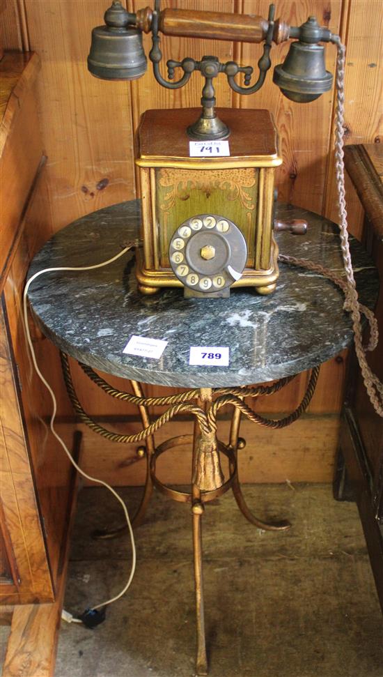 Gilt metal tasselled marble topped table and a reproduction gilt painted telephone receiver (2)(-)